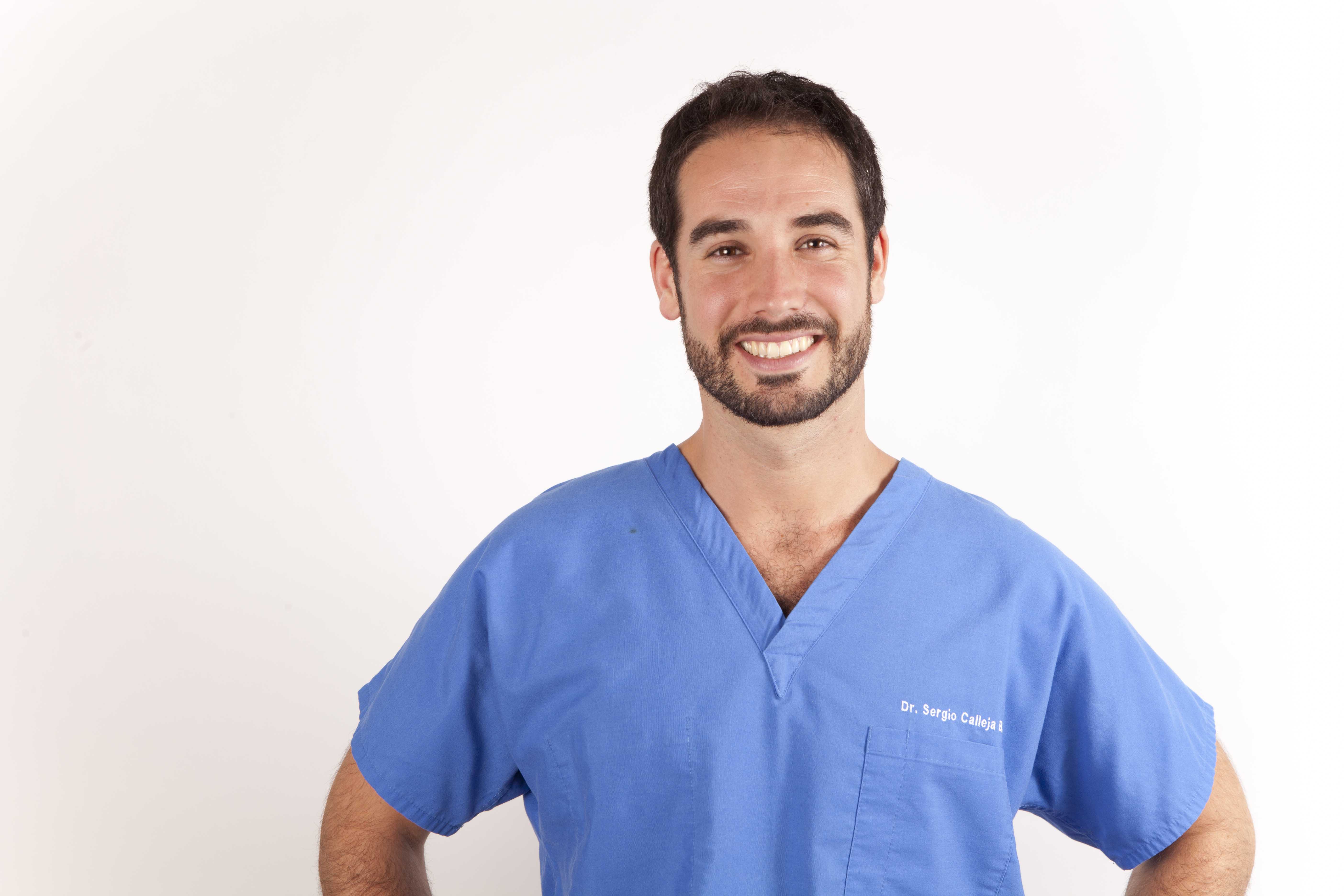 Dr. Sergio Calleja in blue scrubs