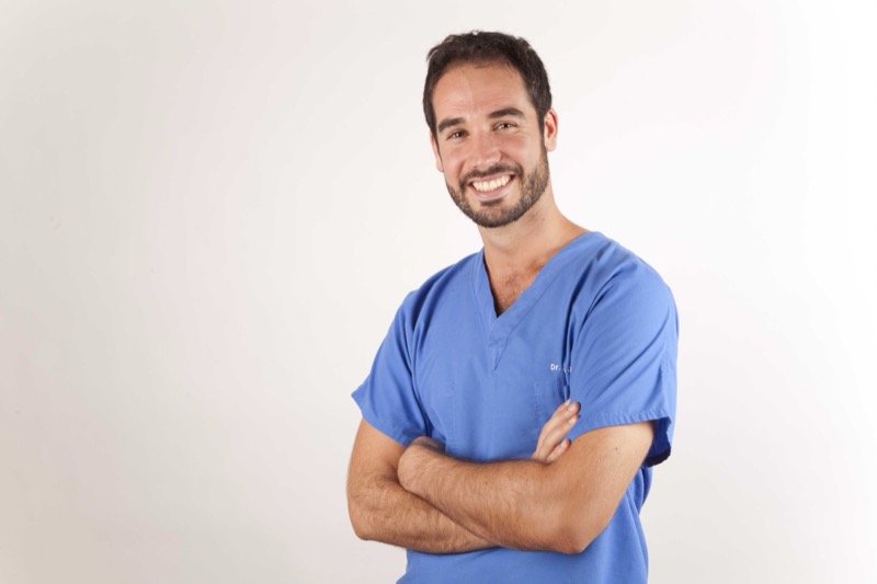 Dr. Sergio Calleja in surgical scrubs